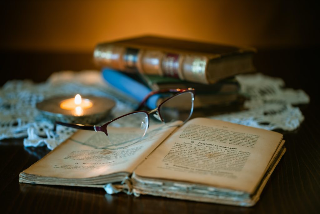 black framed eyeglasses on book page