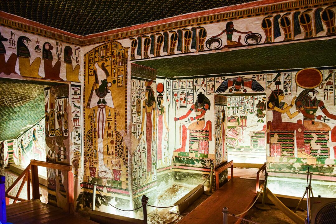 a room with egyptian paintings on the walls